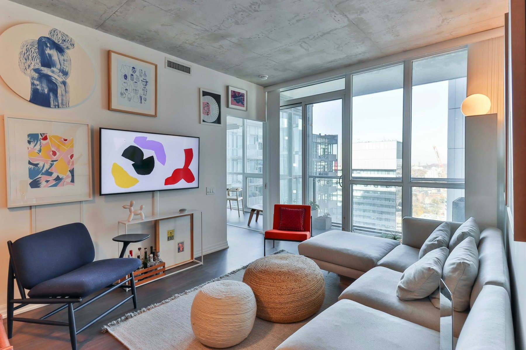 An open living space with seating arranged toward the window