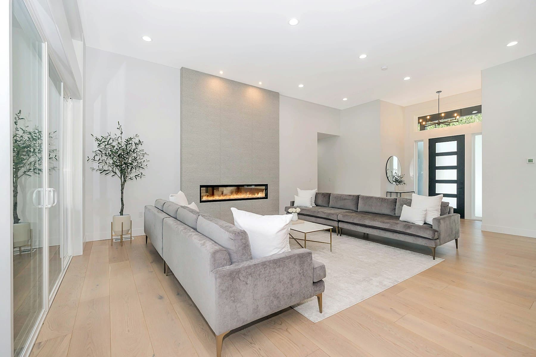 A pale leather two-seat sofa against a bright wall