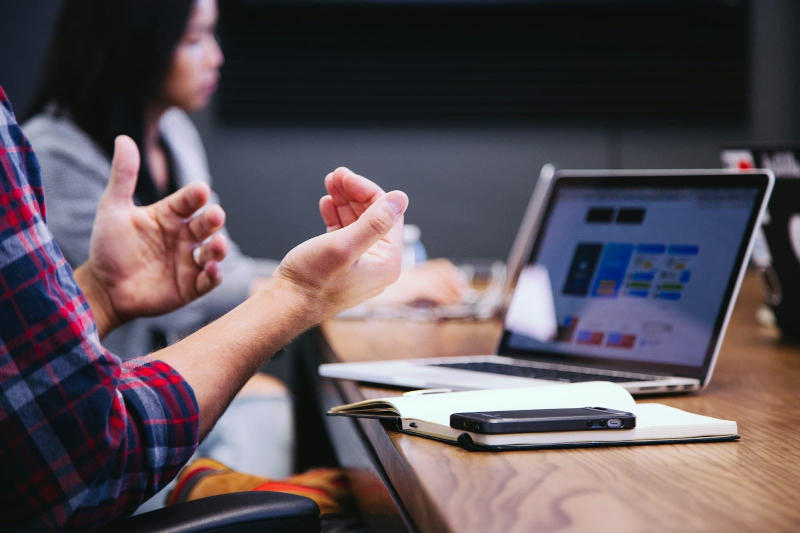 An adviser talking a client through options across a desk